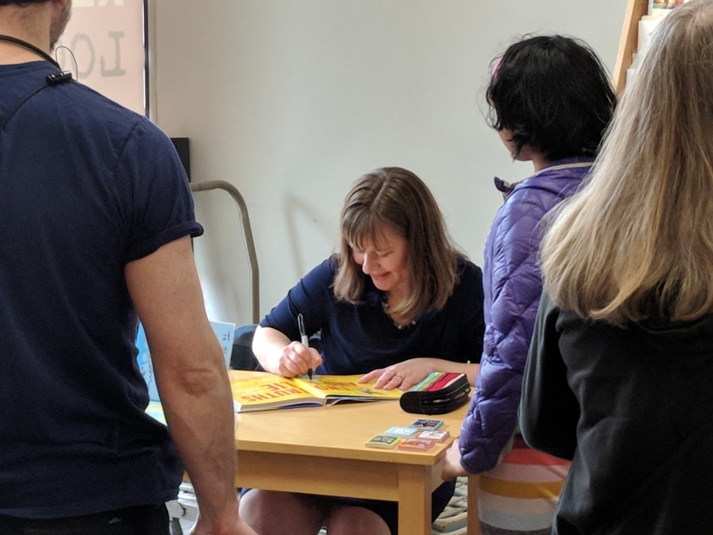 Laurie Ann Thompson signing a book