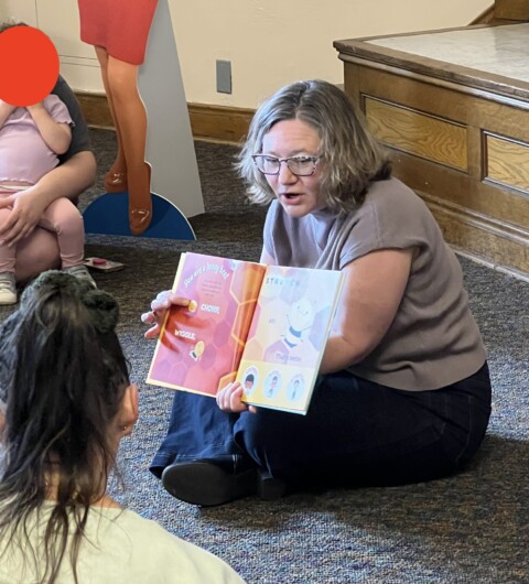 Author Laurie Ann Thompson reading aloud to children from You Are a Honey Bee!